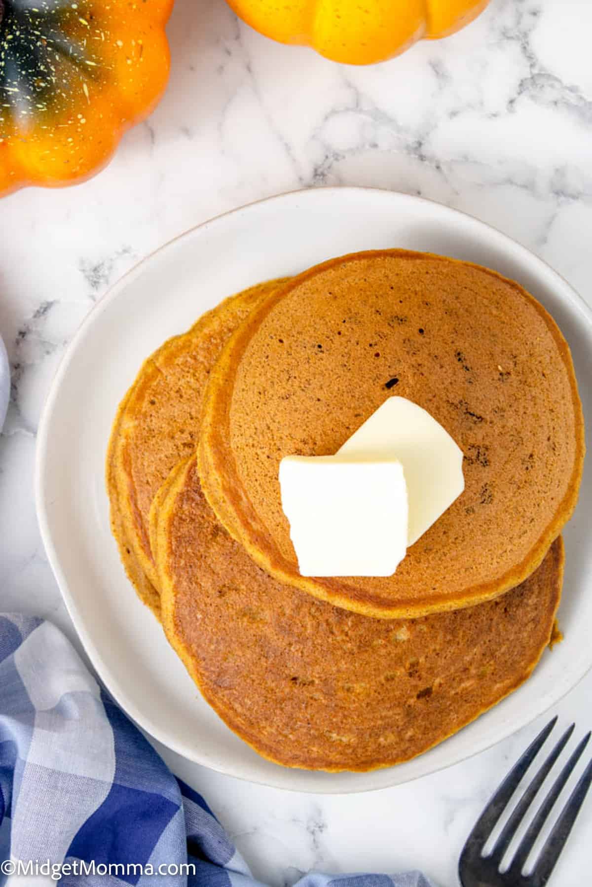 overhead photo of pumpkin pancakes on a plate 