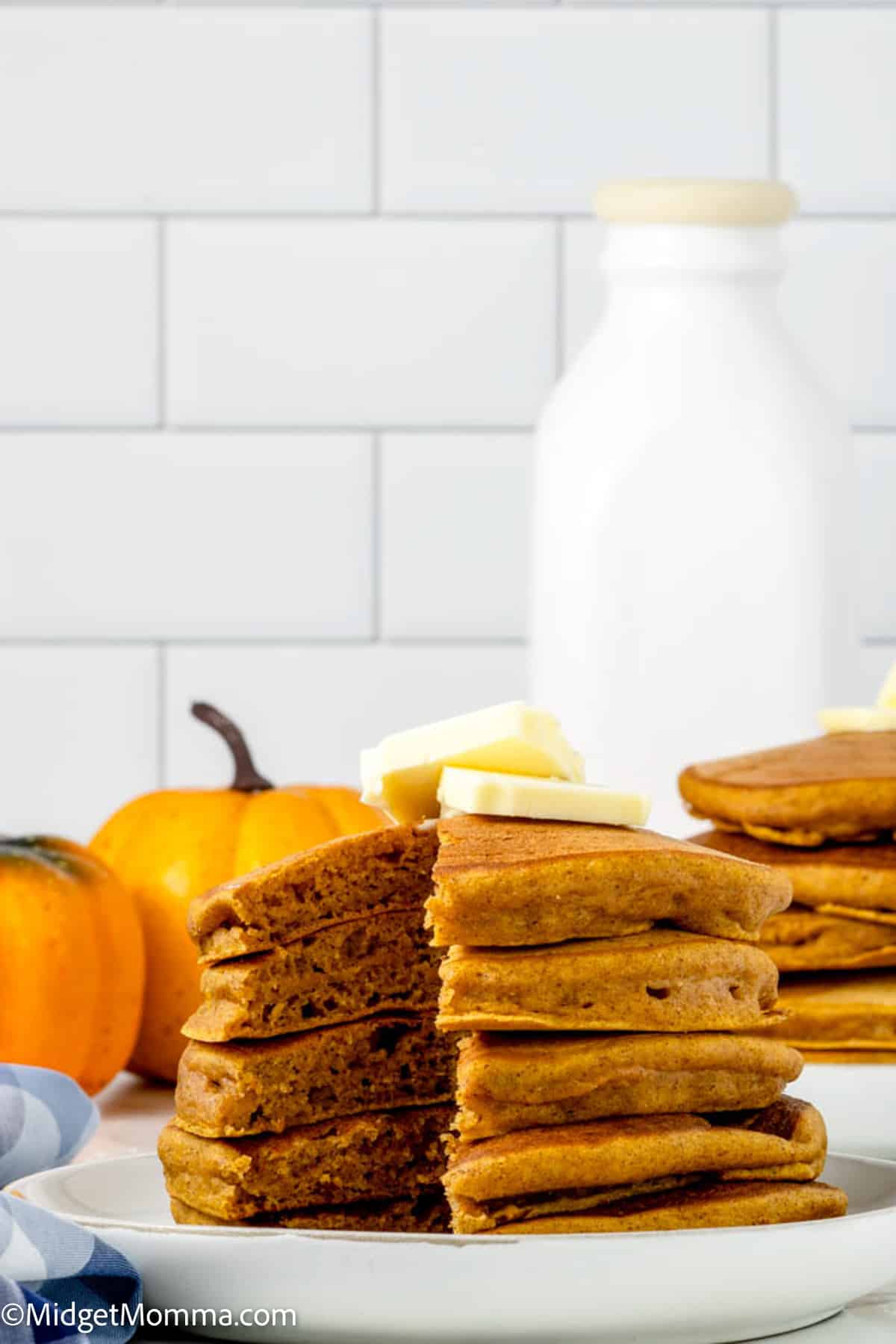 stack pf pumpkin pancakes topped with butter