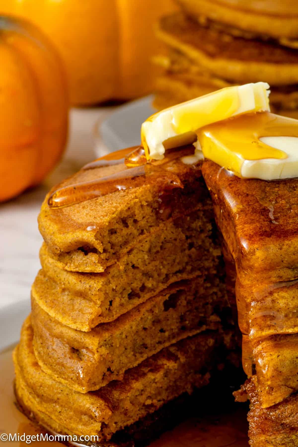 close up photo of a stack of fresh made pumpkin pancakes recipe
