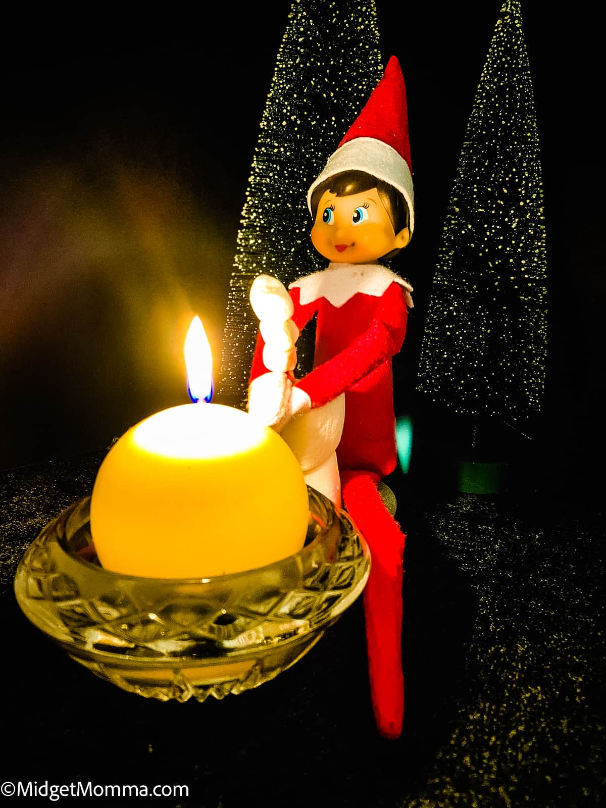 elf roasting a marshmallow over a candle