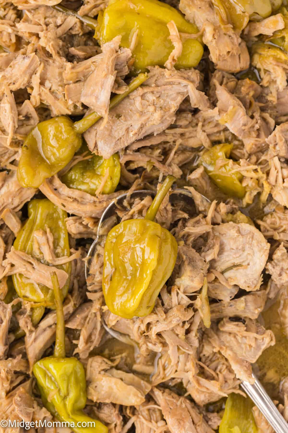close up photo of mississippi pork roast in a serving dish. 