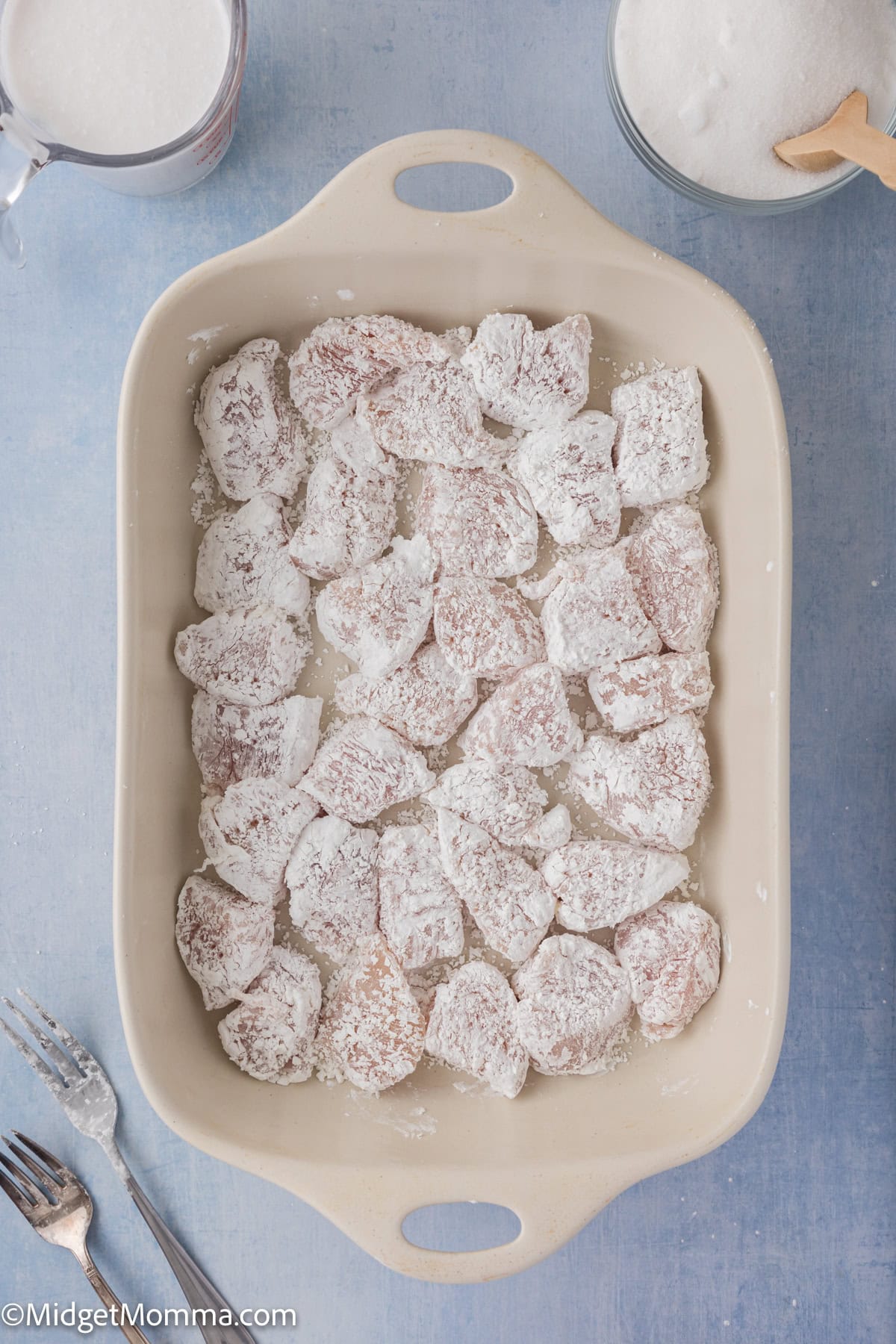 chicken coated in cornstarch in a baking dish